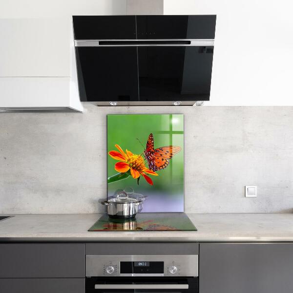 Sklenený obklad do kuchyne Motýľ na letnom kvete