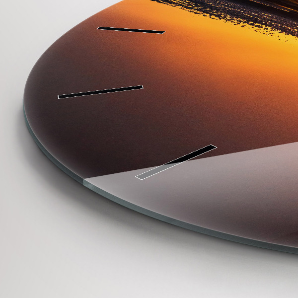 Okrúhle hodiny Bežec a západ slnka