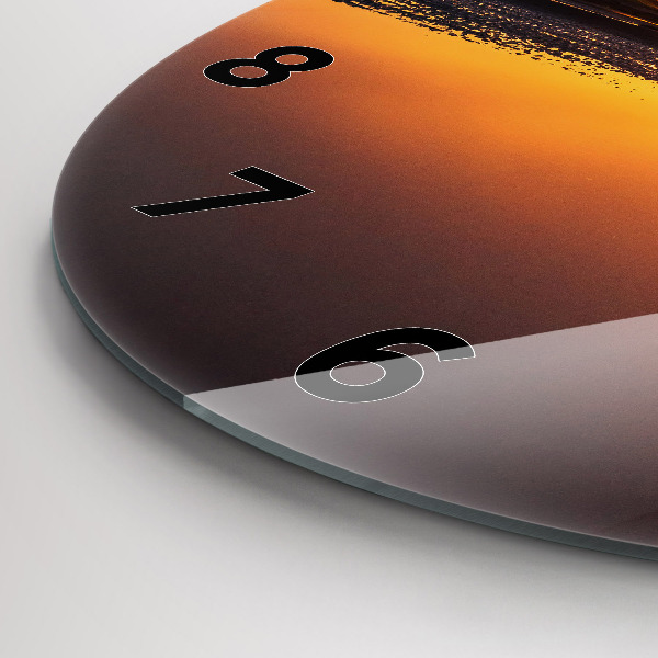 Okrúhle hodiny Bežec a západ slnka